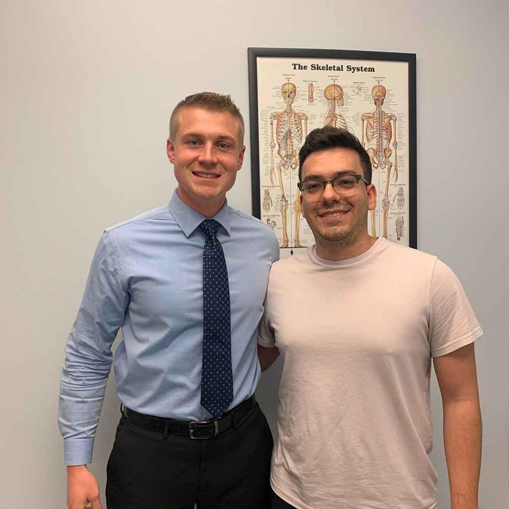 chiropractor doctor working with male patient