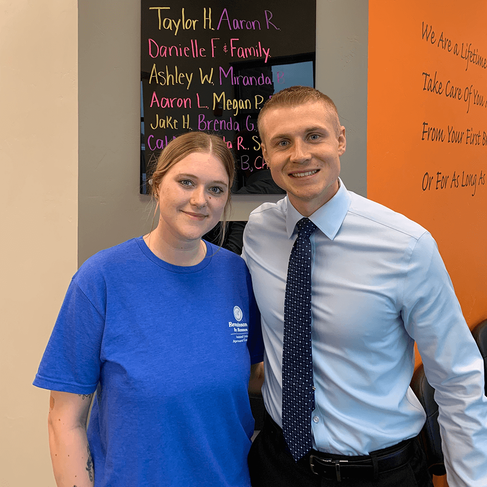 Dr. Hunter Schultz poses with a patient inside his chiropractic care office